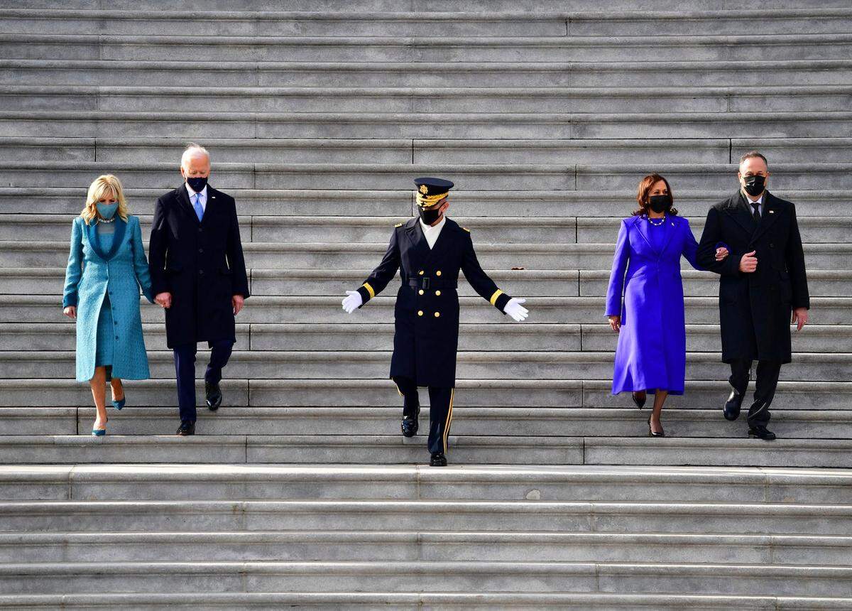 President Joe Biden, first lady Jill Biden, Vice President Kamala Harris and her husband Douglas Emhoff walk down the steps of the U.S. Capitol after they were sworn into office during the inauguration, Wednesday, Jan. 20, 2021, in Washington.