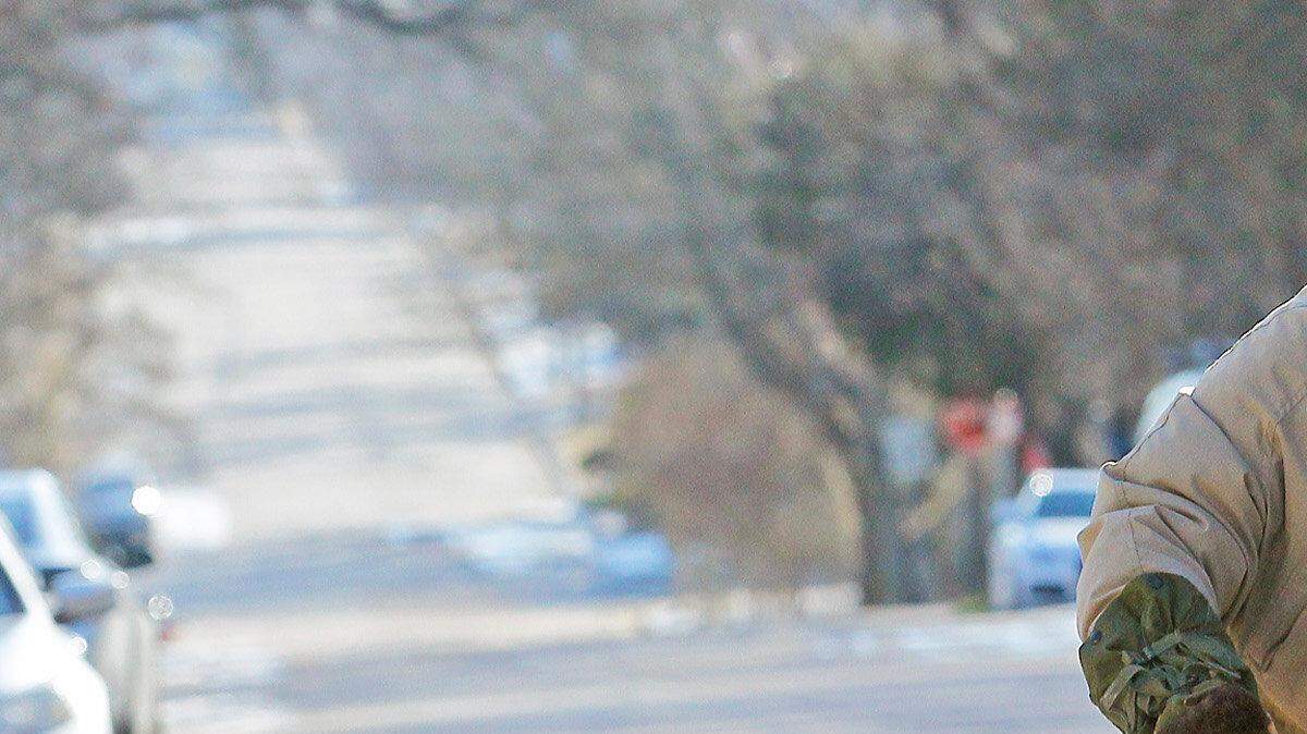 Matt Brown is bundled up to the hilt as he rides his bike to work on East Lane Street in Oakwood in Raleigh, N.C., on Friday morning, Feb. 20, 2015.  With overnight lows dipping into single digits, he needed a coat, boots, scarf, hat, furry gloves and goggles to handle the elements.