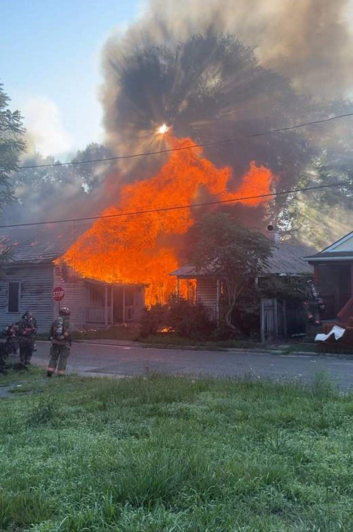 Firefighters battled a blaze at abandoned homes on East Pettigrew Street in Durham, N.C., on Tuesday, July 11, 2023.