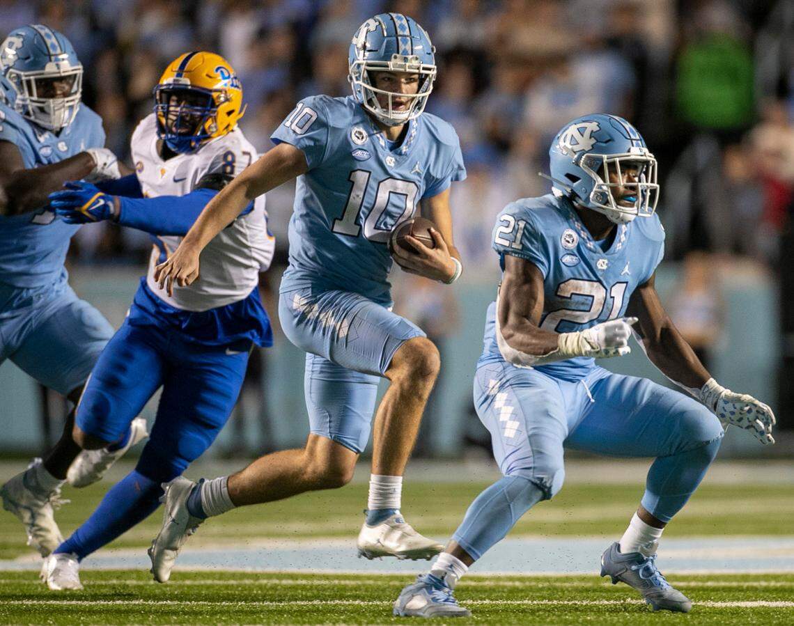 North Carolina quarterback Drake Maye rushes for nine yards in the third quarter against Pitt on Saturday, October 29, 2022 at Kenan Stadium in Chapel Hill, N.C. Maye had 61 yards rushing in the Tar Heels’ victory.