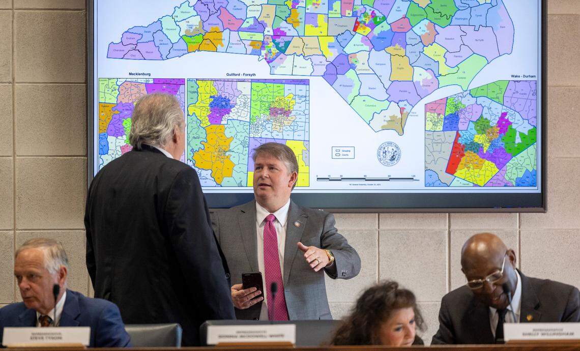 Rep. John Torbett of Gaston County talks with Rep. Grey Mills of Iredell County prior to the House Rules Committee meeting on Tuesday, October 24, 2023 in Raleigh, N.C. The committee approved House Bill 898 Edition 2, which will advance the redistricting map to a floor vote.