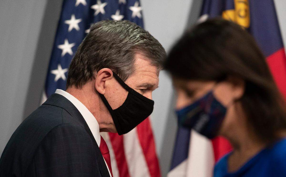 North Carolina Governor Roy Cooper and Dr. Mandy Cohen, Secretary of the North Carolina Department of Health and Human Services.