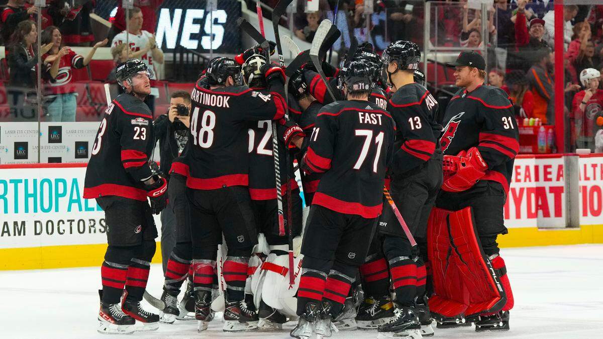 Carolina Hurricanes players celebrate their victory against the Toronto Maple Leafs at PNC Arena.