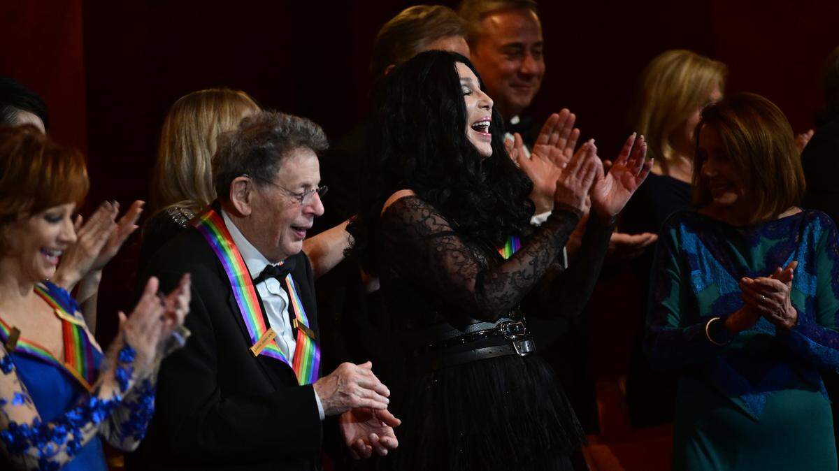 An extraordinary group of renowned artists gather in Washington D.C. to salute this year’s honorees at The 41st Annual Kennedy Center Honors, broadcast Dec. 26 on CBS. Pictured L-R: Reba McEntire, Phillip Glass, Cher, and House of Representatives Minority Leader Nancy Pelosi.