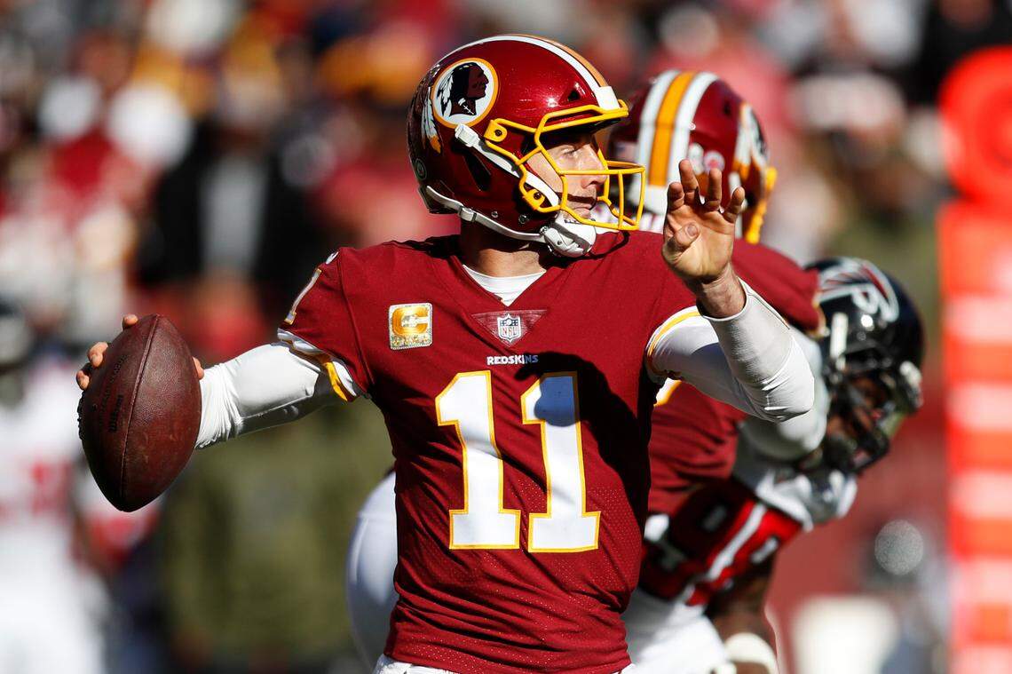 In this 2018 file photo, Washington Redskins quarterback Alex Smith (11) passes the ball during a game against the Atlanta Falcons on Nov. 4, 2018 in Landover, Md.