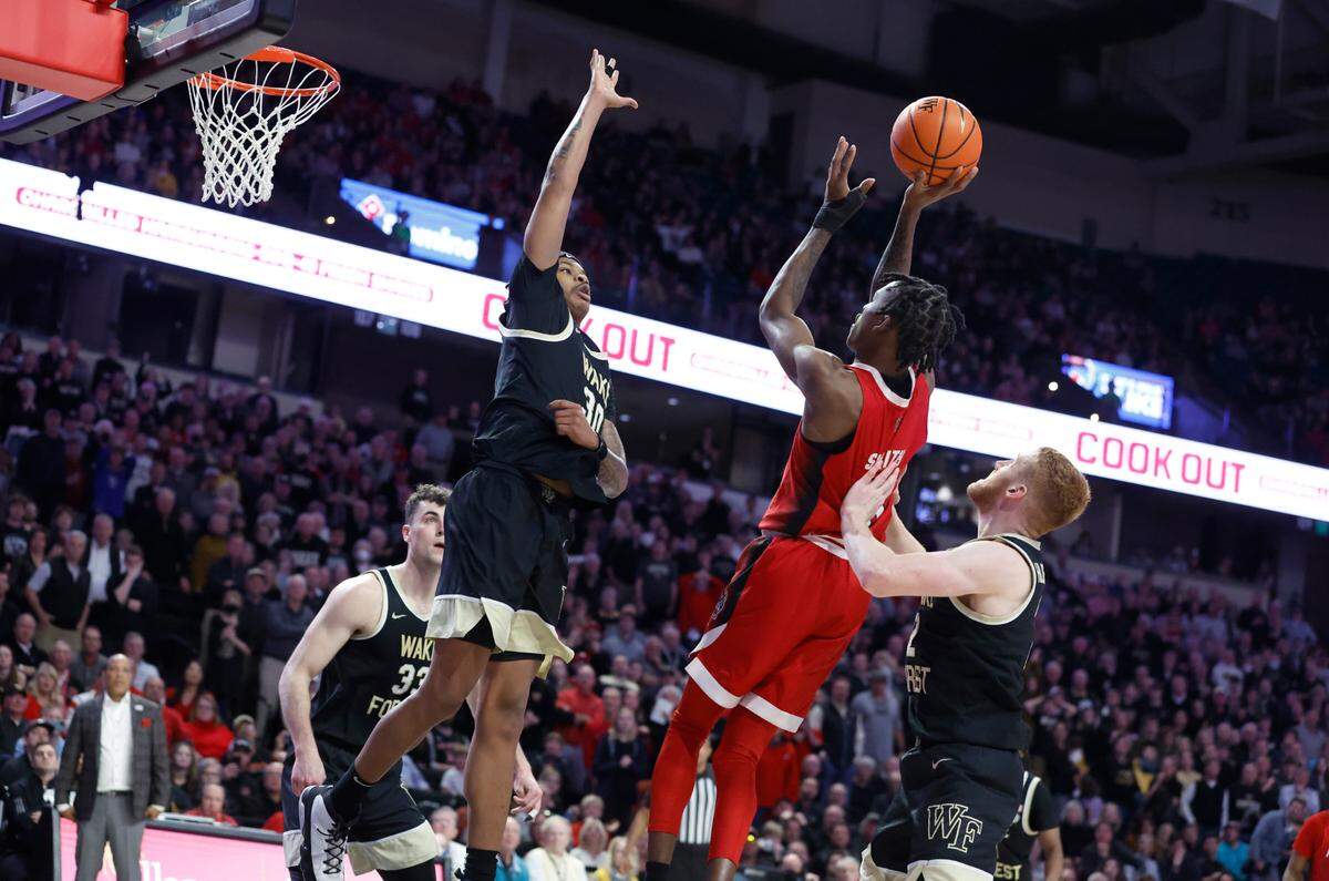 N.C. State’s Terquavion Smith (0) makes the basket with 38 seconds left in the game to put the Wolfpack up by 3 during N.C. State’s 79-77 victory over Wake Forest at Joel Coliseum in Winston-Salem, N.C., Saturday, Jan. 28, 2023.