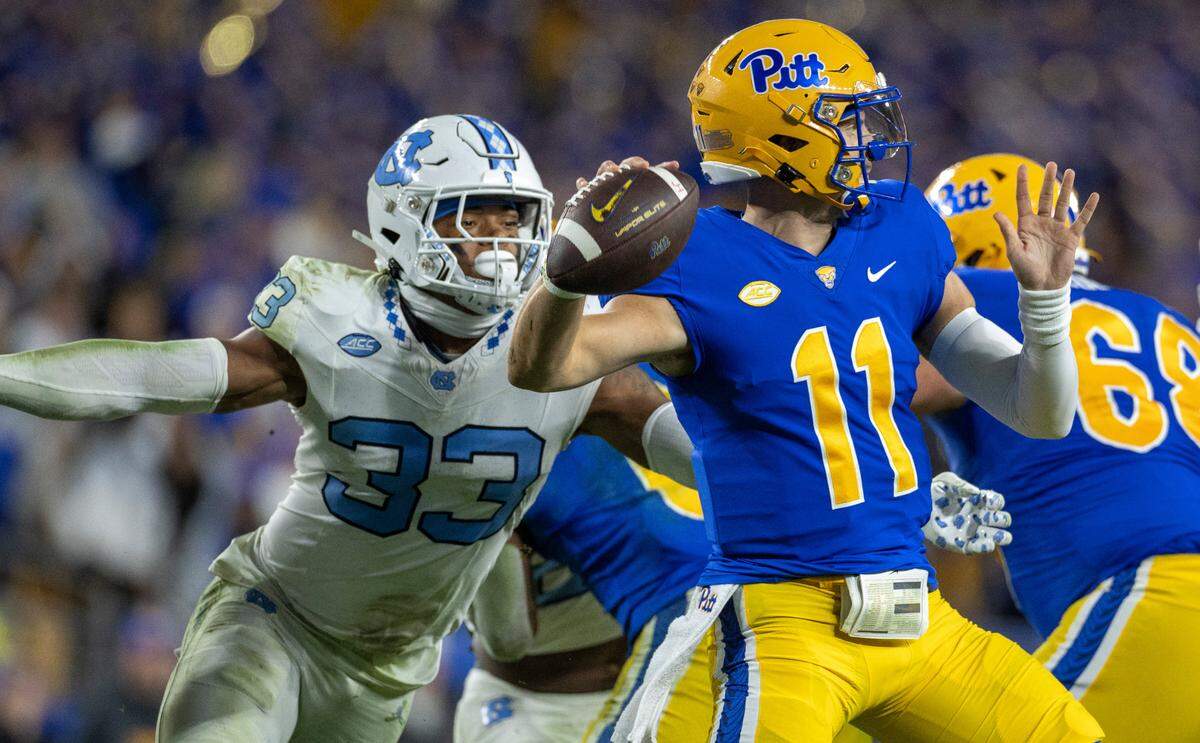 North Carolina’s Cedric Gray (33) pressures Pitt quarterback Christian Veilleux (11) in the third quarter on Saturday, September 23, 2023 at Acrisure Stadium in Pittsburgh, Pa.