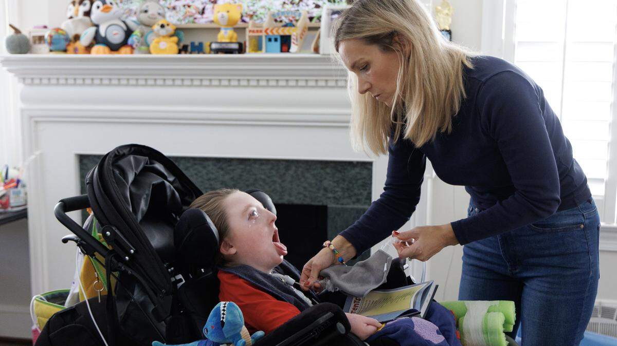 Mary Mac Jenkins helps her 9-year-old son, Miles, who lives with spastic quadriplegic cerebral palsy, at their home in Raleigh, Oct. 17, 2025. Jenkins fears that North Carolina’s Medicaid payment cuts could strain the nursing workforce that helps provide Miles with round-the-clock care. 