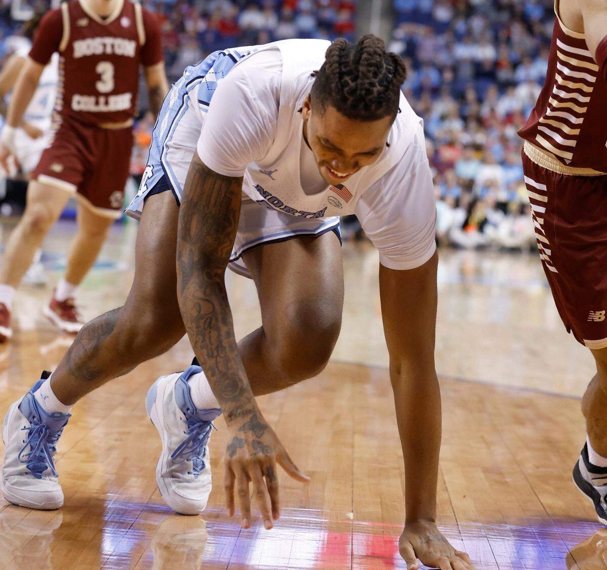 North Carolina’s Armando Bacot (5) grimaces after he was injured during the first half of UNC’s game against Boston College in the second round of the New York Life ACC Men’s Basketball Tournament in Greensboro, N.C., Wednesday, March 8, 2023.