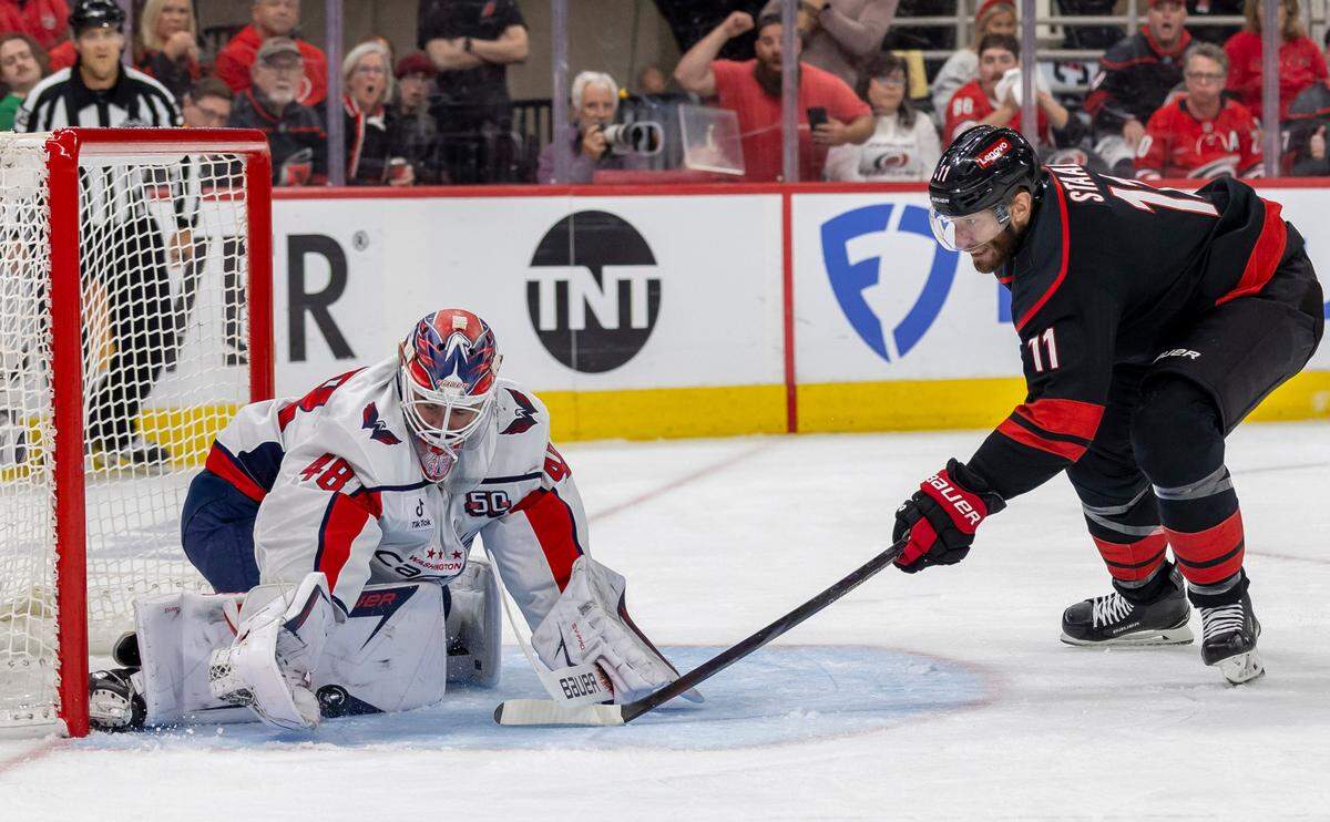 Washington Capitals goalie Logan Thompson (48) stops a scoring attempt by Carolina Hurricanes center Jordan Staal (11) in the first period during Game 4 of their series on Monday, May 12, 2025 at Lenovo Center in Raleigh, N.C.
