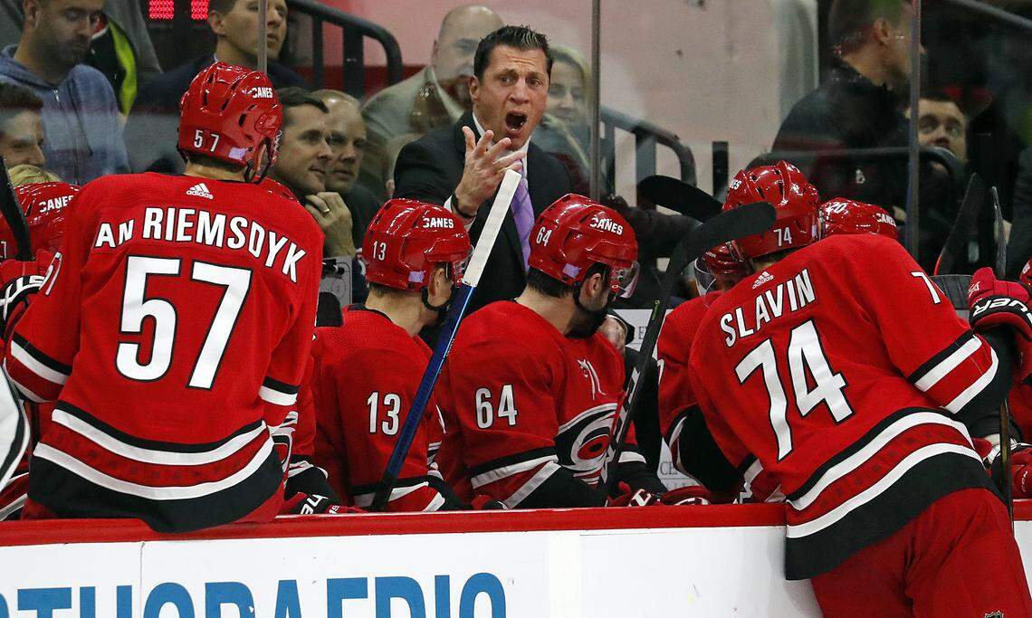 Carolina Hurricanes head coach Rod Brind’ Amour, top center, takes a timeout to talk to his team during the second period of an NHL hockey game against the Columbus Blue Jackets, Saturday, Nov. 17, 2018, in Raleigh, N.C. (AP Photo/Karl B DeBlaker)