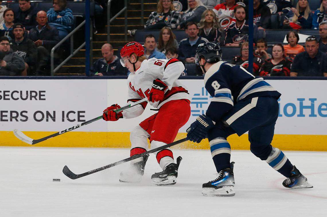 Carolina Hurricanes right wing Jackson Blake (53) carries the puck as Columbus Blue Jackets defenseman Zach Werenski (8) defends during the first period at Nationwide Arena on April 16, 2024.