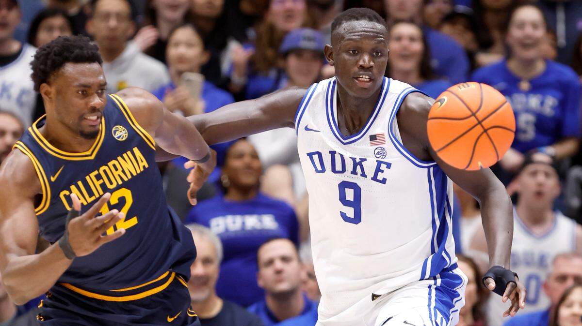Duke’s Khaman Maluach (9) and California’s Mady Sissoko (12) go after the ball during the first half of Duke’s game against Cal at Cameron Indoor Stadium in Durham, N.C., Wednesday, Feb. 12, 2025.