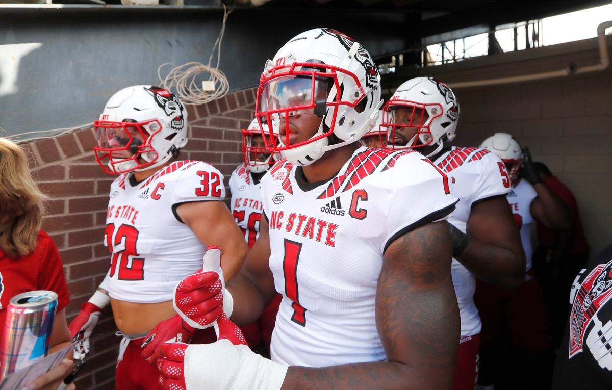 N.C. State linebacker Isaiah Moore (1) gets ready to head onto the field before N.C. States game against ECU at Dowdy-Ficklen Stadium in Greenville, N.C., Saturday, Sept. 3, 2022.