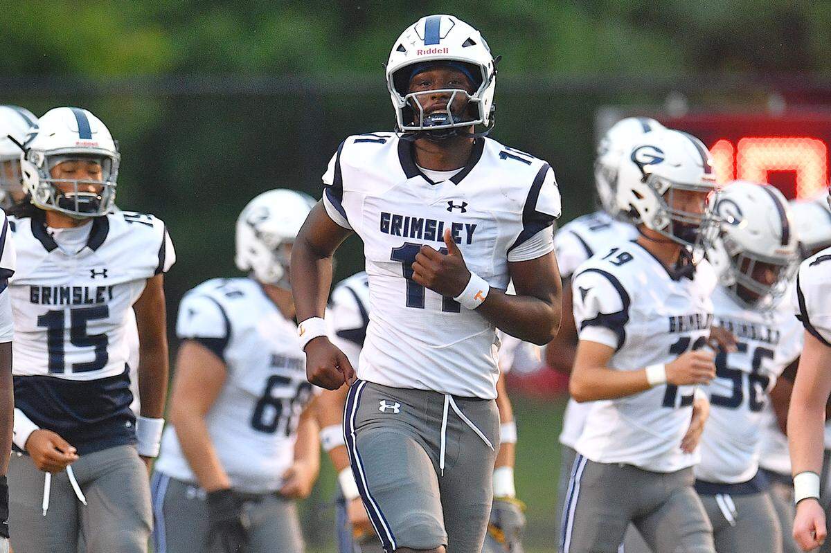 Grimsley quarterback Faizon Brandon (11) takes to the field during pre-game against Rolesville. The Rolesville Rams and the Greensboro Grimsley Whirlies met in a non-conference football game in Rolesville, N.C. on August 30, 2024.