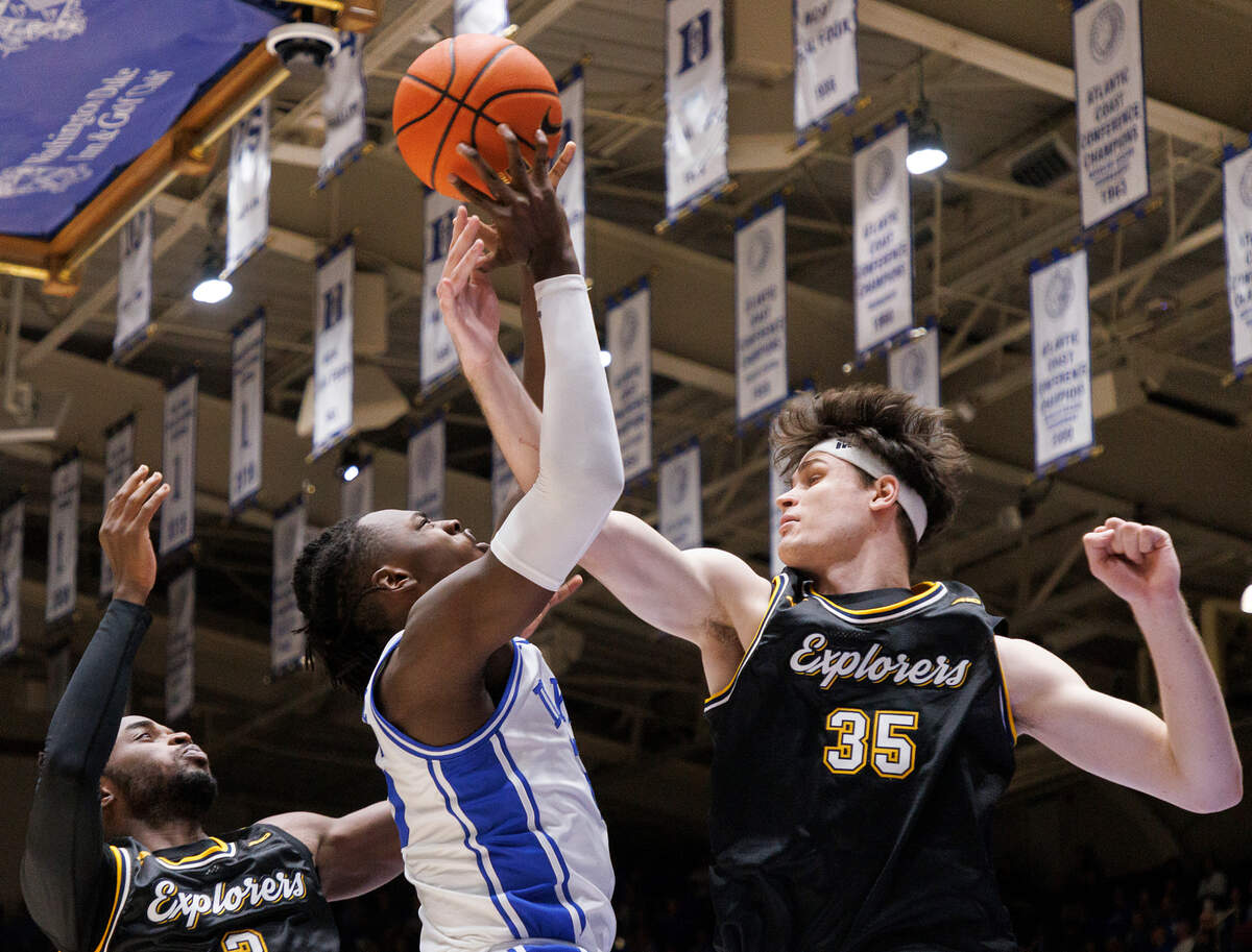 Duke’s Mark Mitchell drives to the basket past La Salle’s Anwar Gill and Rokas Jocius during the first half of the Blue Devils’ 95-66 win on Tuesday, Nov. 21, 2023, at Cameron Indoor Stadium in Durham, N.C.