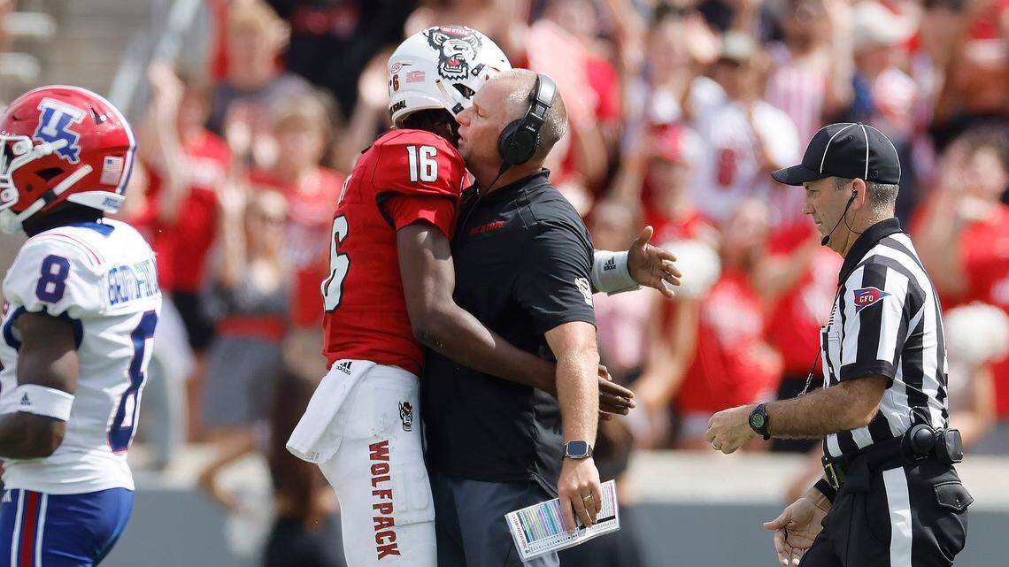 N.C. State head coach Dave Doeren chest bumps quarterback CJ Bailey (16) during the second half of N.C. State’s 30-20 victory over LA Tech at Carter-Finley Stadium in Raleigh, N.C., Saturday, Sept. 14, 2024.