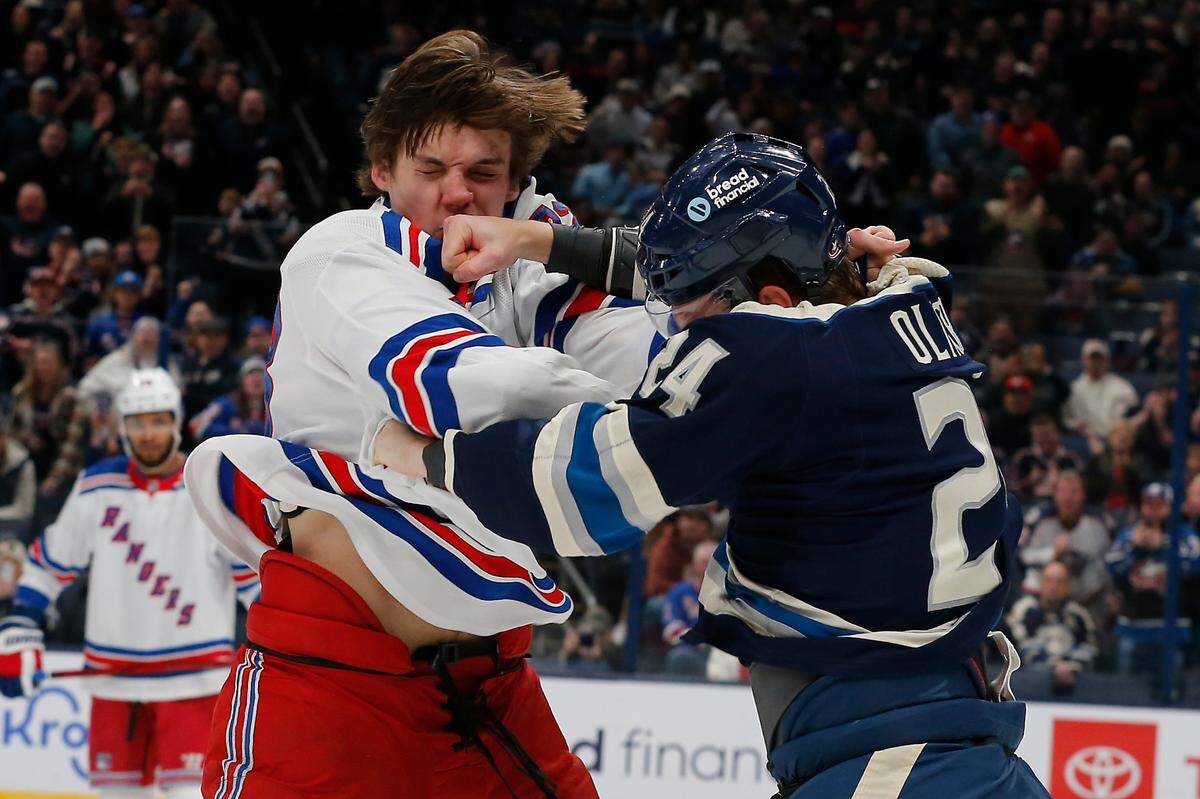 Columbus Blue Jackets right wing Mathieu Olivier (24) and New York Rangers center Matt Rempe (73) fight during the first period at Nationwide Arena.