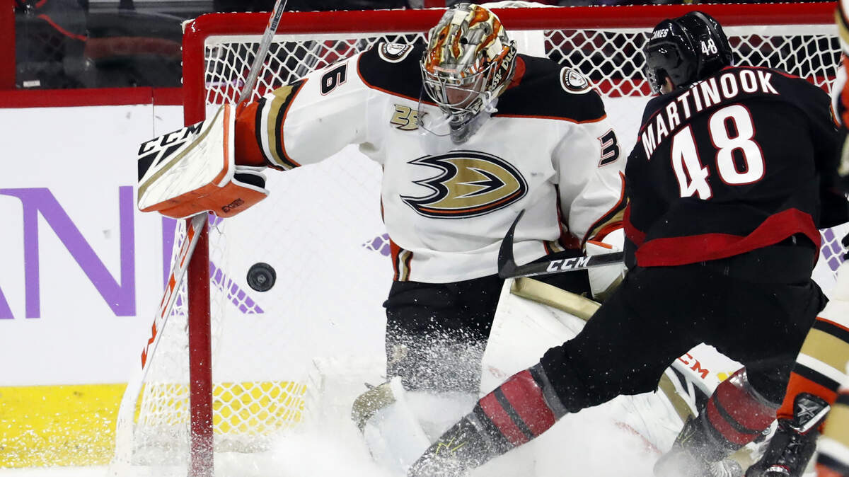 Carolina Hurricanes’ Jordan Martinook (48) has his shot blocked by Anaheim Ducks goaltender John Gibson (36) during the first period of an NHL hockey game, Friday, Nov. 30, 2018, in Raleigh