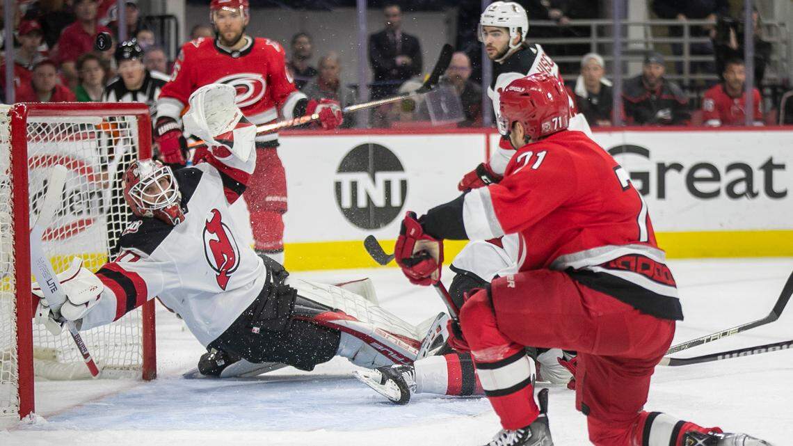 The New Jersey Devils goalie Akira Schmid (40) deflects a shot on goal in the first period against the Carolina Hurricanes during Game 5 of their second round Stanley Cup playoff series on Thursday, May 11, 2023 at PNC Arena in Raleigh, N.C.