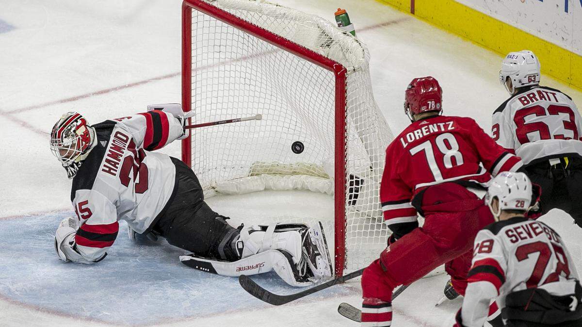 Carolina Hurricanes’ Steven Lorentz (78) scores on New Jersey goalie Andrew Hammond (35) during the third period on Thursday, April 28, 2022 at PNC Arena in Raleigh, N.C. The Hurricanes rolled to a 6-3 win to finish the regular season.