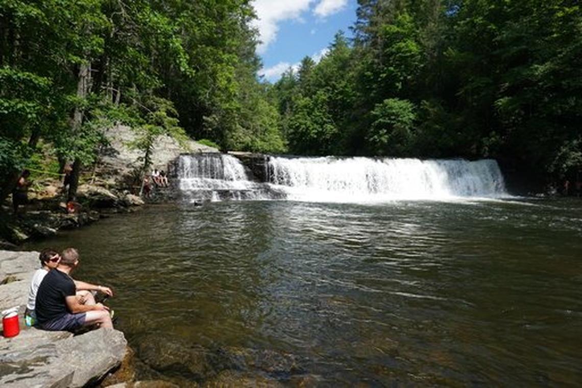 During the coronavirus pandemic, more people have sought escapes to Western North Carolina and nature, giving those towns a new boost of tourism. Even without the encouragement of advertising, tourists came back this fall. This 2018 photo shows Hooker Falls, located in the DuPont State Recreational Forest between Brevard and Hendersonville.