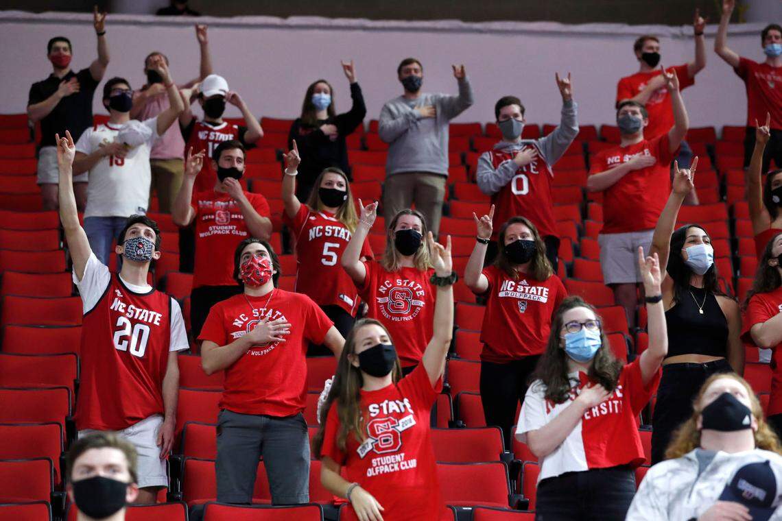 Fans cheer on the Wolfpack before N.C. State’s game against Pittsburgh at PNC Arena in Raleigh, N.C., Sunday, February 28, 2021.