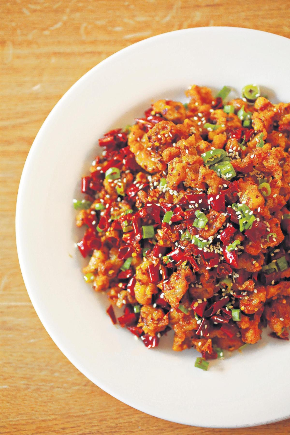 Chengdu 7’s Chongqing chicken, another Sichuan standard, gets a solid rendering with crisp, lightly battered nuggets of wok-fried chicken, tossed with copious shards of toasted red chile.