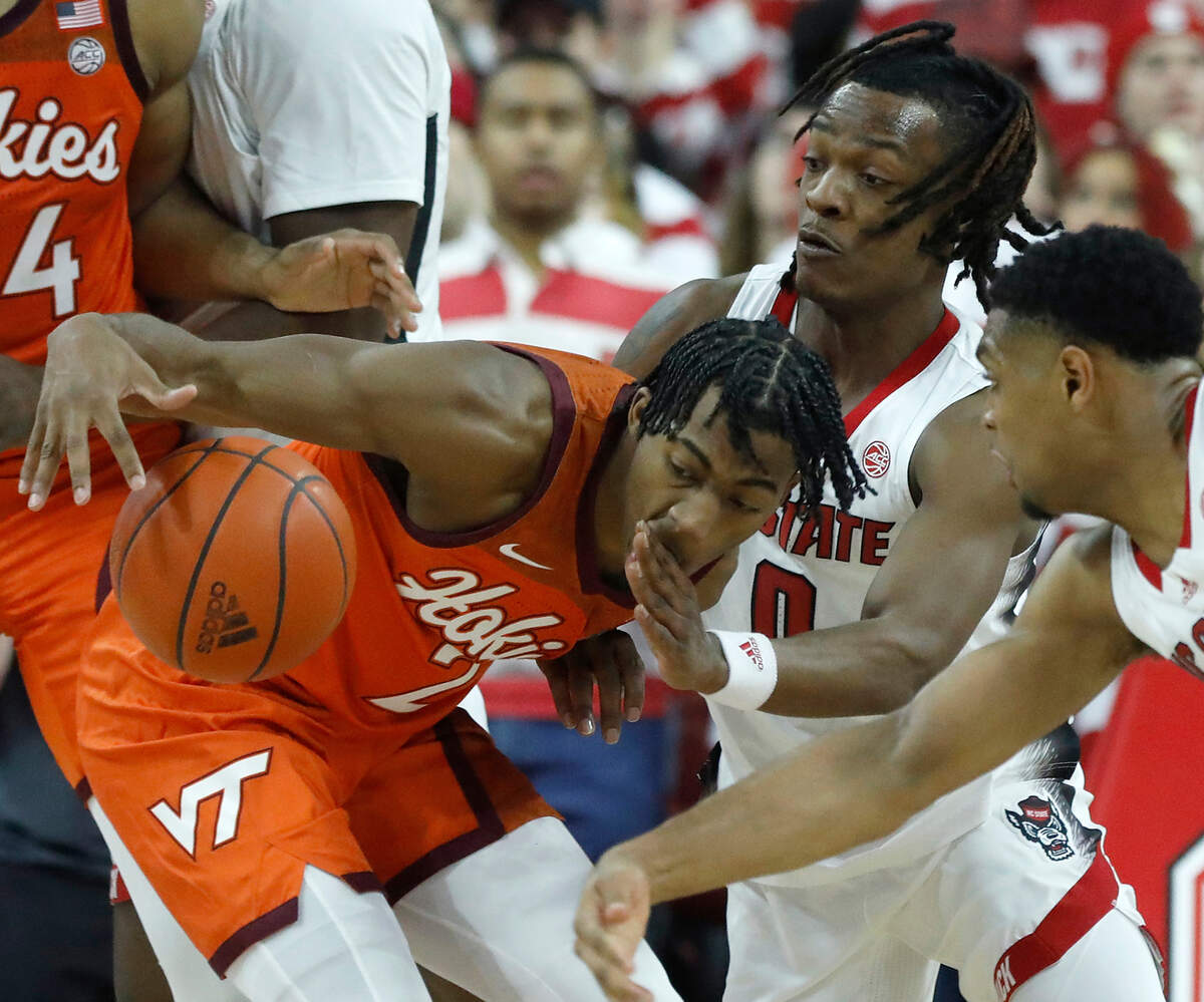 N.C. State’s DJ Horne pressures Virginia Tech’s MJ Collins during the second half of the Wolfpack’s 84-78 loss on Saturday, Jan. 20, 2024, at PNC Arena in Raleigh, N.C.