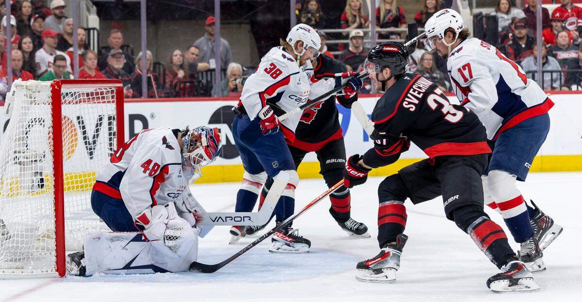 Washington Capitals goalie Logan Thompson stops a scoring attempt by Carolina Hurricanes right wing Andrei Svechnikov (37) in the first period during Game 3 of their series on Saturday, May 10, 2025 at Lenovo Center in Raleigh, N.C.
