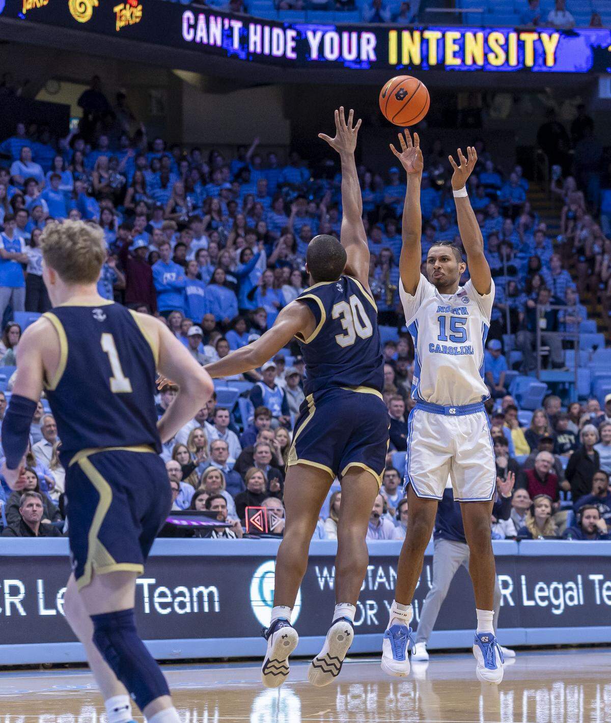 North Carolina forward Jarin Stevenson (15) launches a three-point basket to give the Tar Heels a double-digit lead in the second half against Navy on Tuesday, November 18, 2025 at the Smith Center in Chapel Hill, N.C. Stevenson had 11 points in the Tar Heels’ victory. 