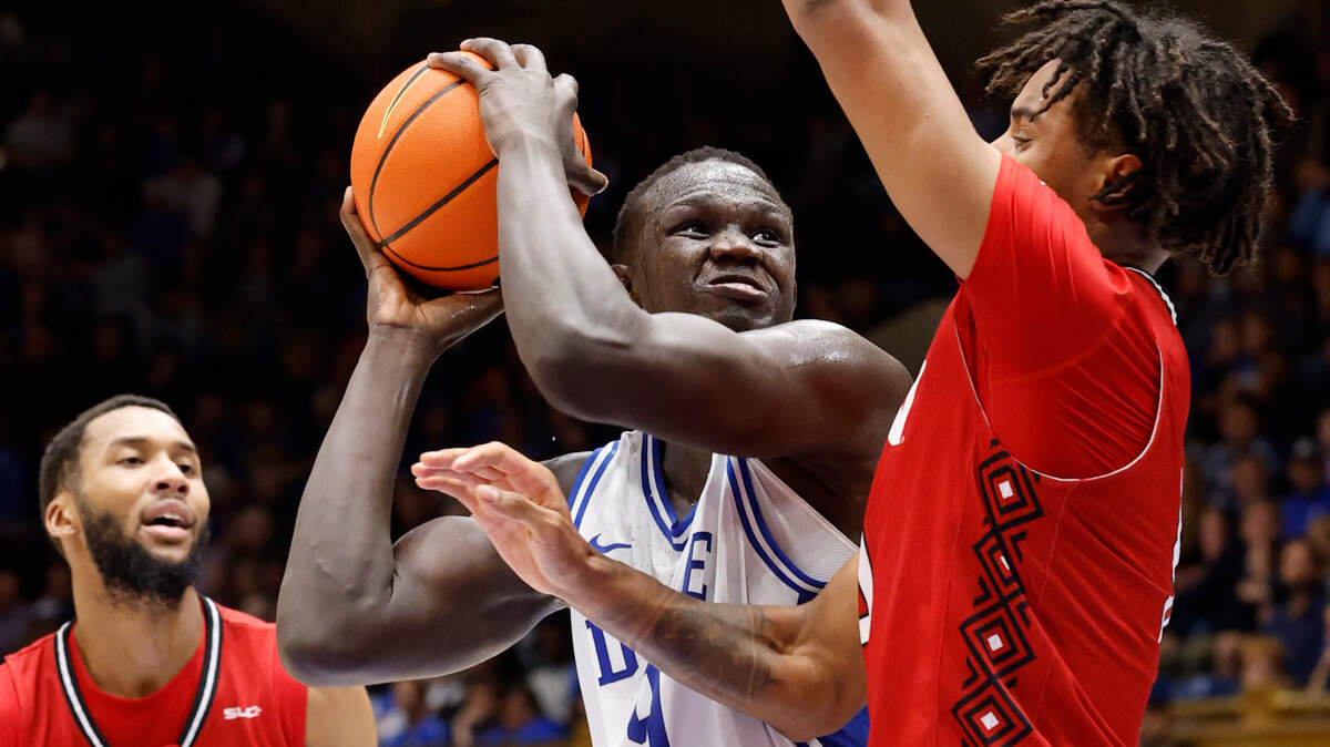 Duke’s Khaman Maluach (9) prepares to shoot as Incarnate Word’s Lamin Sabally (9) defends during the first half of Duke’s game against Incarnate Word at Cameron Indoor Stadium in Durham, N.C., Tuesday, Dec. 10, 2024.