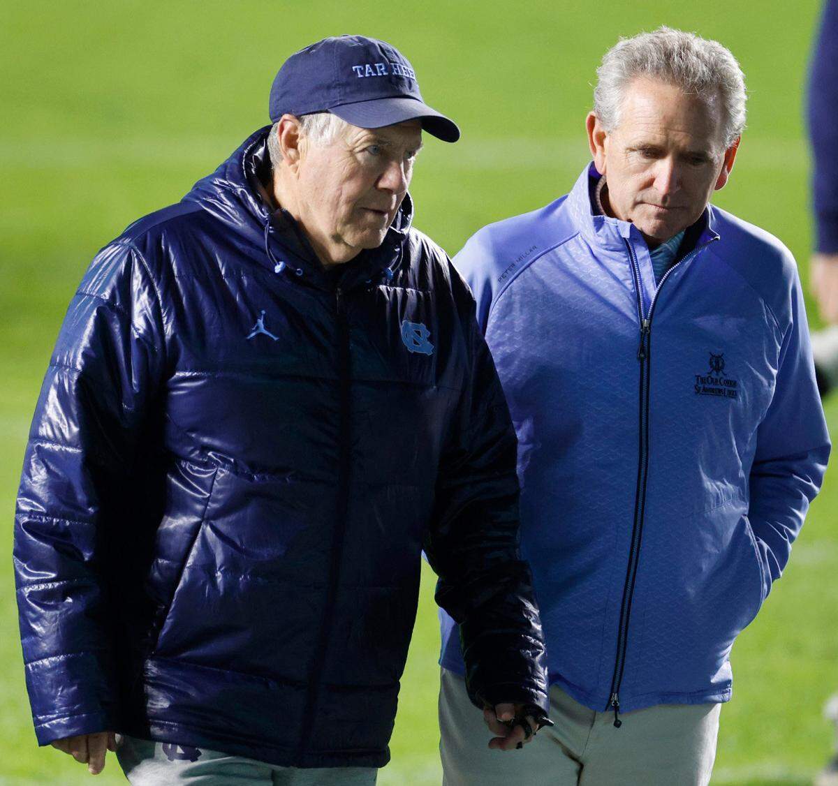 North Carolina head football coach Bill Belichick talks with athletic director Bubba Cunningham after UNC football's Practice Like a Pro open practice at Kenan Stadium in Chapel Hill, N.C., Saturday, April 12, 2025.
