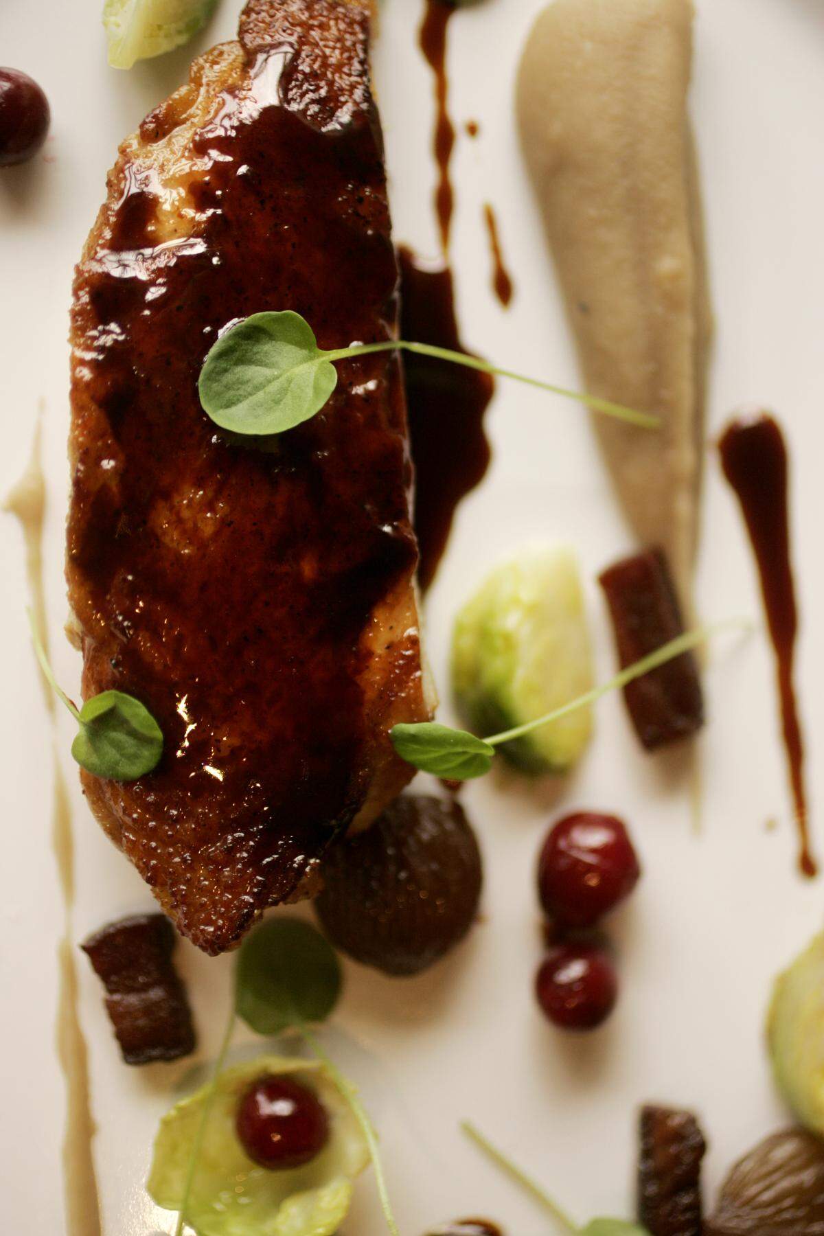 The Roasted Pheasant with chestnut puree, poached cranberries, brussels sprouts and toasted honey jus is a current menu item at Herons located inside The Umstead Hotel and Spa in Cary.