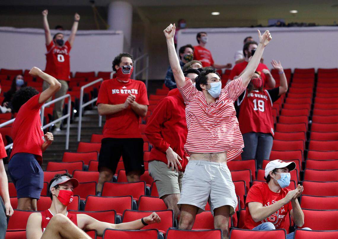 N.C. State fans react after Pittsburgh missed a free throw during the second half of N.C. State’s 65-62 victory over Pittsburgh at PNC Arena in Raleigh, N.C., Sunday, February 28, 2021.