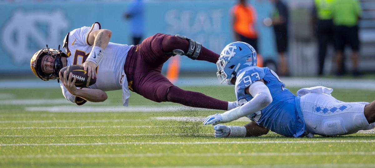 North Carolina’s Jacolbe Cowan (93) sacks Minnesota quarterback Athan Kaliakmanis (8) in the fourth quarter on Saturday, September 16, 2023 at Kenan Stadium in Chapel Hill N.C.