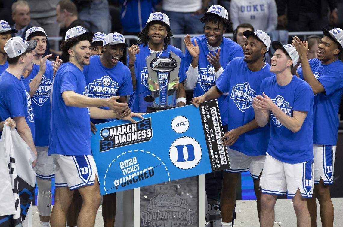 The Duke Blue Devils celebrate their 74-70 victory over Virginia, accepting the championship trophy on Saturday, March 14, 2026, at Spectrum Center in Charlotte, North Carolina.