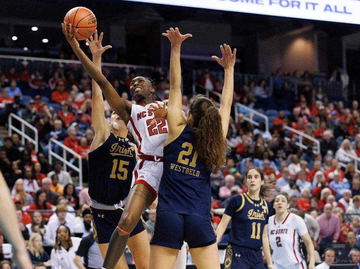 N.C. State’s Saniya Rivers puts up a shot between Notre Dame’s Natalija Marshall and Maddy Westbeld during the second half of the Wolfpack’s 55-51 loss in the ACC Tournament final on Sunday, March 10, 2024, at Greensboro Coliseum in Greensboro, N.C.