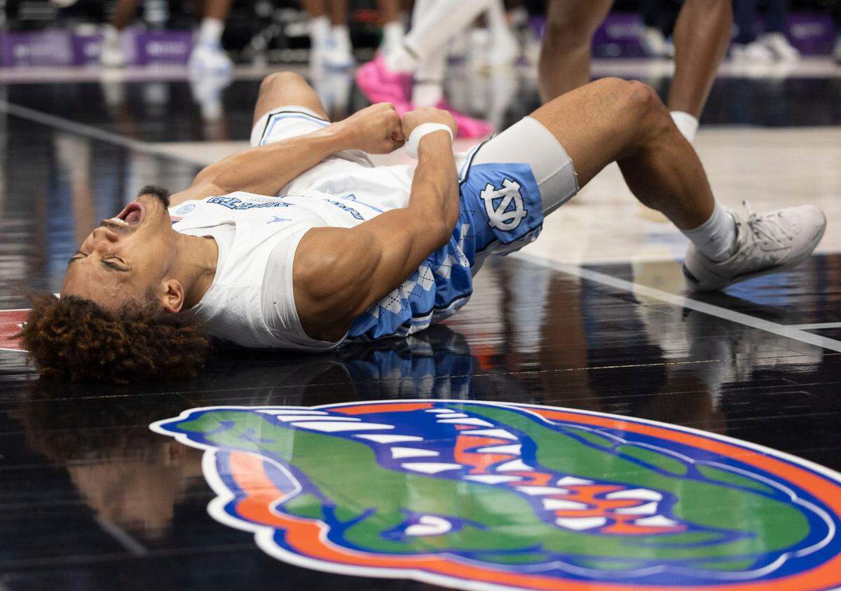 North Carolina guard Seth Trimble (7) reacts after sinking a basket and collecting a foul to give the Tar Heels a 69-68 lead in the second half against Florida during the Jumpman Invitational on Tuesday, December 17, 2024 at the Spectrum Center in Charlotte, N.C. North Carolina fell 90-84 to Florida.