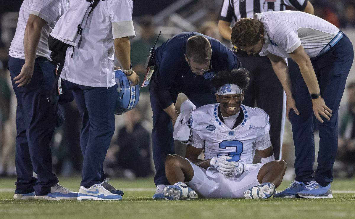 North Carolina wide receiver Chris Culliver (3) is attended to by medical personnel after an injury in the second quarter on Saturday, September 6, 2025 at Jerry Richardson Stadium in Charlotte, N.C. 