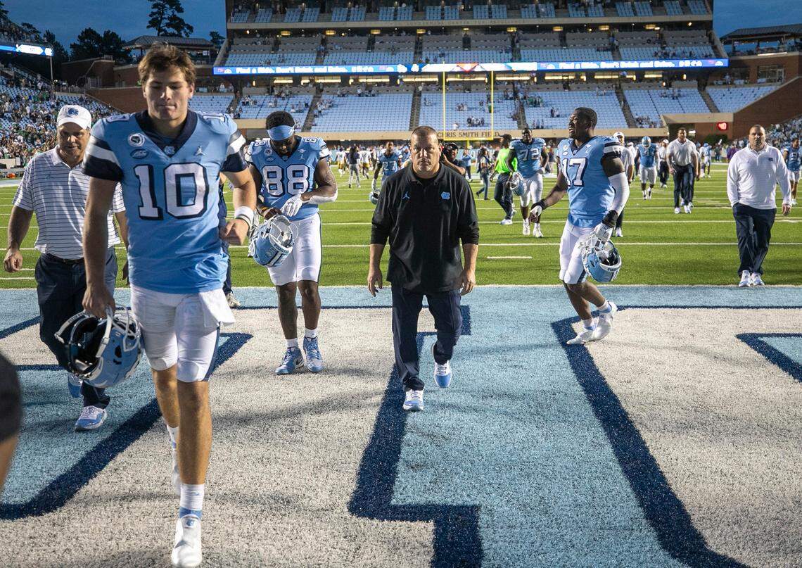 North Carolina offensive coordinator Phil Longo and quarterback Drake Maye leave the field following their 45-32 loss to Notre Dame on Saturday, September 24, 2022 at Kenan Stadium in Chapel Hill, N.C.