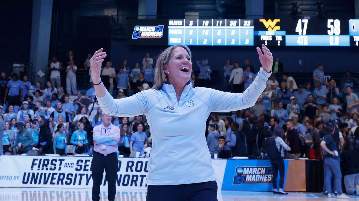 North Carolina head coach Courtney Banghart celebrates with the fans after UNC’s 58-47 victory over West Virginia in the second round of the NCAA women’s basketball tournament at Carmichael Arena in Chapel Hill, N.C., Monday, March 24, 2025.