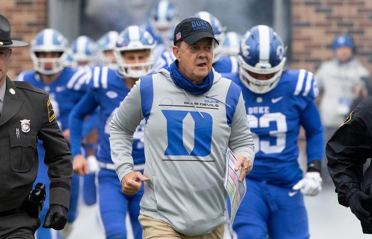 Duke Head Coach David Cutcliffe jogs onto the field prior to the start of their game against Pittsburgh in 2021.