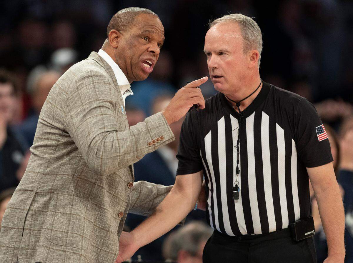 North Carolina coach Hubert Davis has a word with official John Gaffney following a technical foul on Armando Bacot (5) during the first half against Connecticut in the Jimmy V Classic on Tuesday, December 5, 2023 at Madison Square Garden in New York, NY.