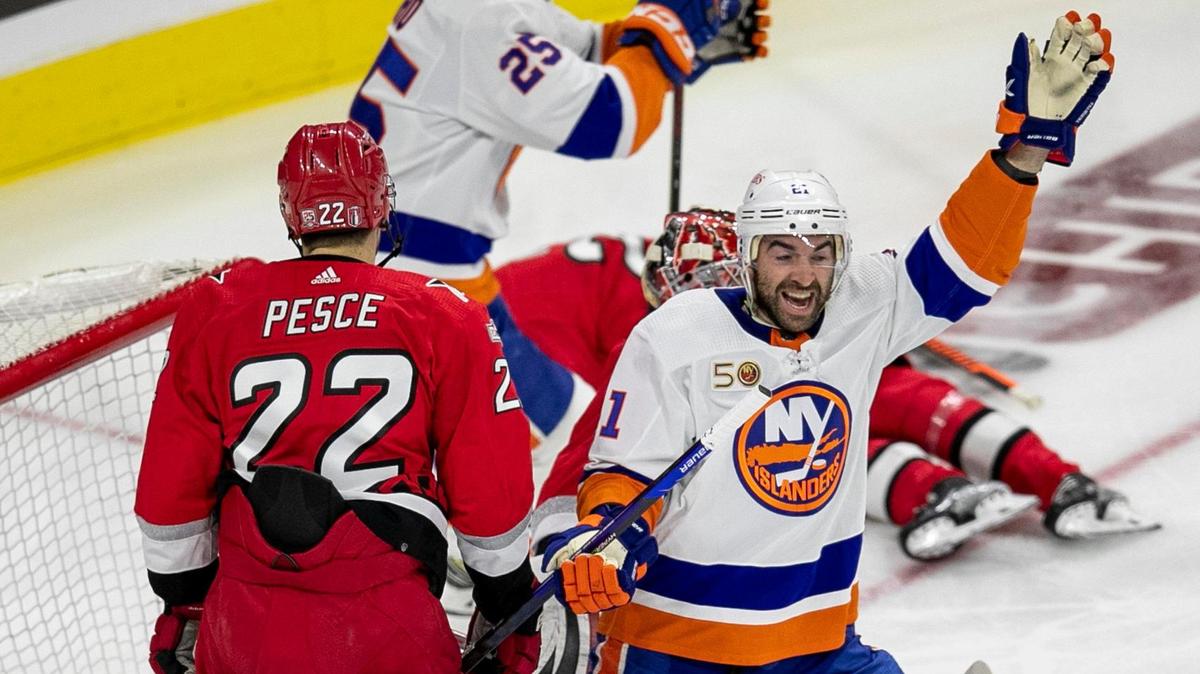 The New York Islanders Kyle Palmeri (21) reacts after a goal buy teammate Brock Nelson (29) to give the Islanders a 2-0 lead over the Carolina Hurricanes in the second period during Game 5 of their Stanley Cup series on Tuesday, April 25, 2023 at PNC Arena in Raleigh, N.C.