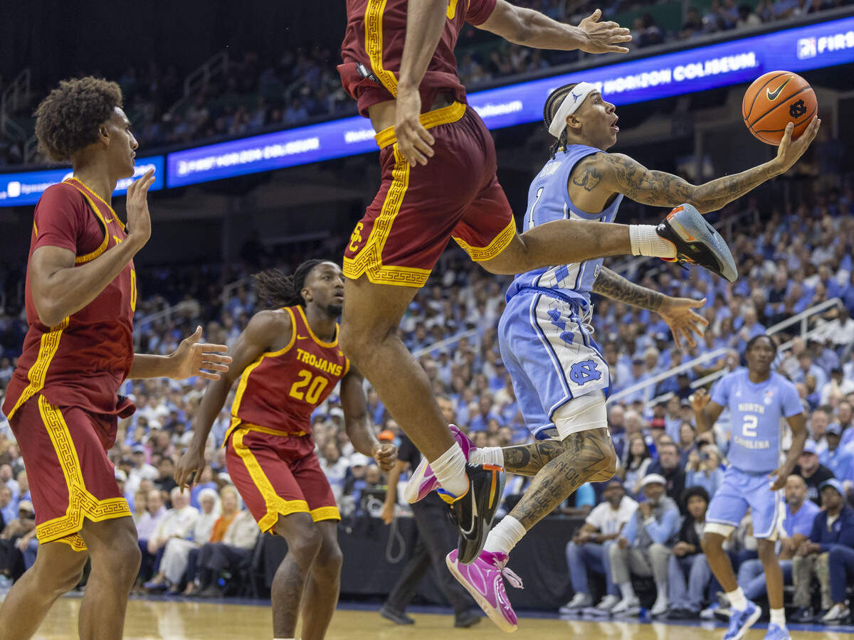 North Carolina guard Terrence Brown (1) breaks to the basket against the Southern California defense of forward Jacob Cofie (5) in the second half on Friday, Oct. 9, 2026, at the First Horizon Coliseum in Greensboro, N.C.