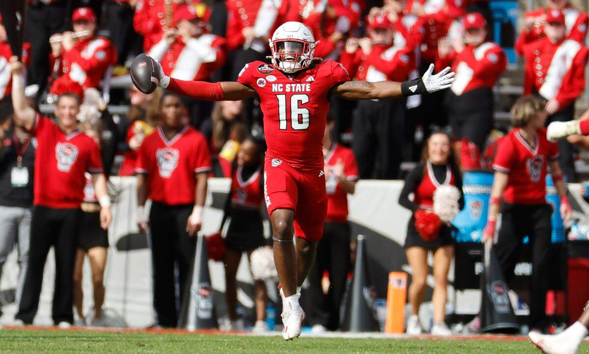N.C. State cornerback Devon Marshall (16) celebrates after intercepting the ball during the second half of N.C. State’s 59-28 victory over Stanford at Carter-Finley Stadium in Raleigh, N.C., on Saturday, Nov. 2, 2024.