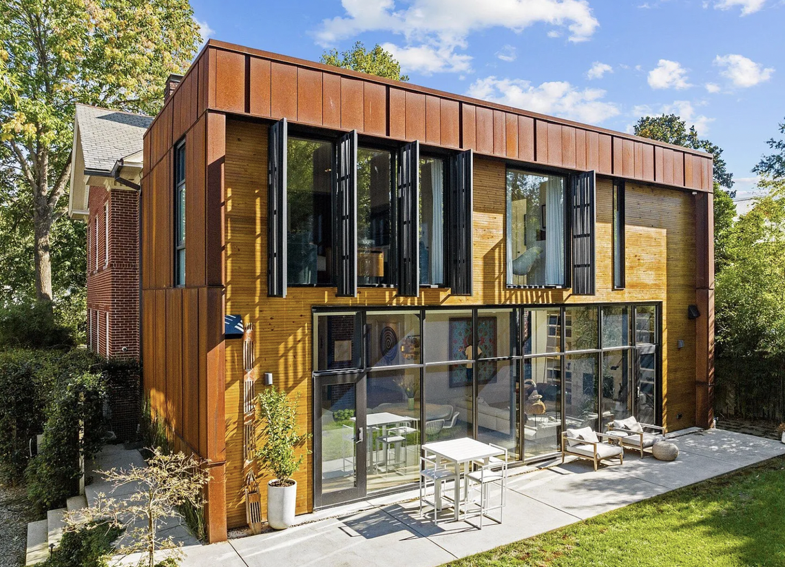 From the back, the 5,682-square-foot three-story home at 117 Hillcrest Road boasts modern aesthetics in Raleigh’s Forest Park.