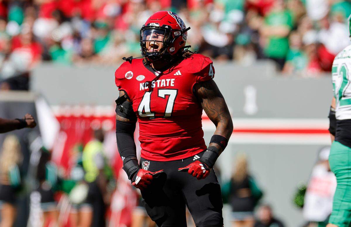 N.C. State defensive lineman Red Hibbler (47) celebrates after sacking Marshall quarterback Cam Fancher (14) during the first half of N.C. State’s game against Marshall at Carter-Finley Stadium in Raleigh, N.C., Saturday, Oct. 7, 2023.