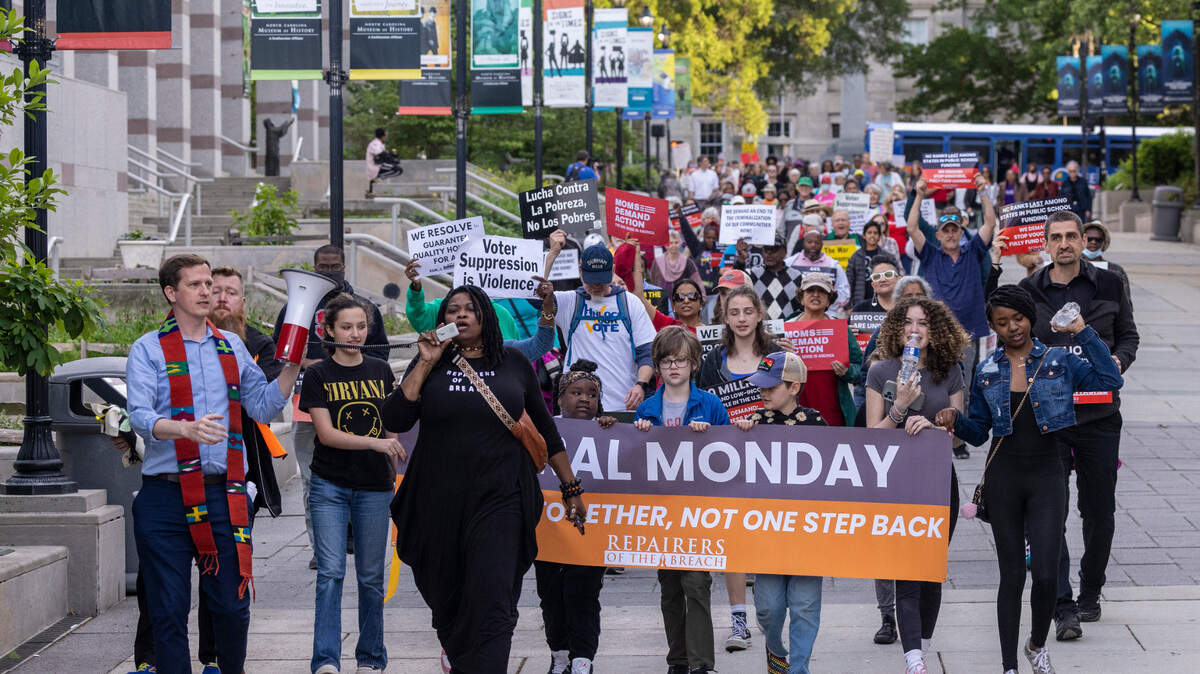 Demonstrators march between the State Capitol and the North Carolina Legislative Building during a Moral Monday march and rally Monday, April 24, 2023. Organizers of the Moral Monday protests that began in 2013 as a backlash against conservative state laws marked a decade of social activism Monday night.